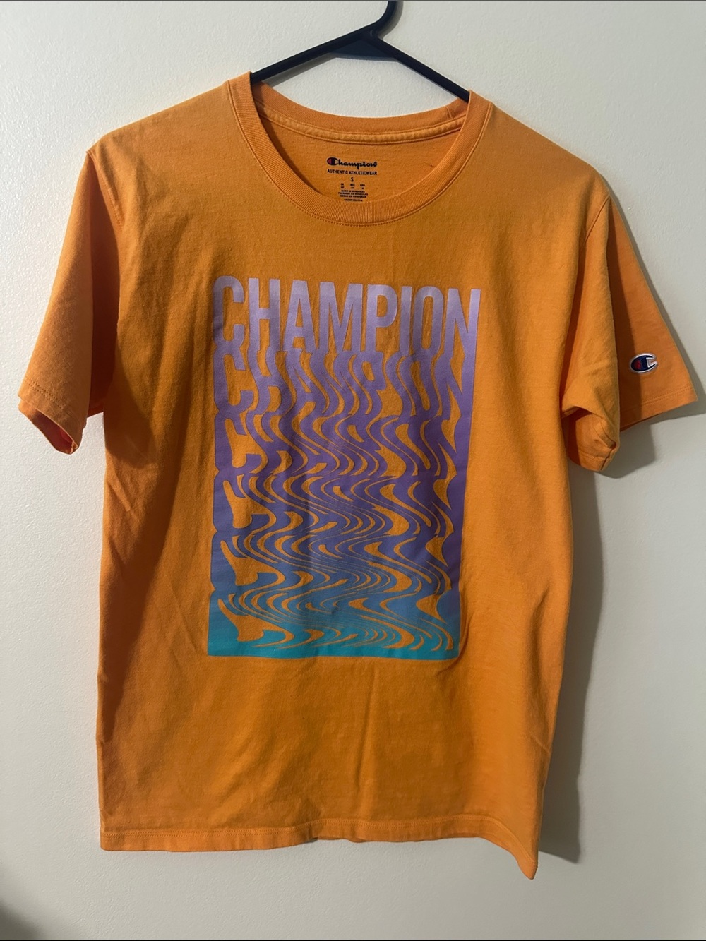 Champion Orange Short-Sleeve Graphic Tee with Purple & Teal Print